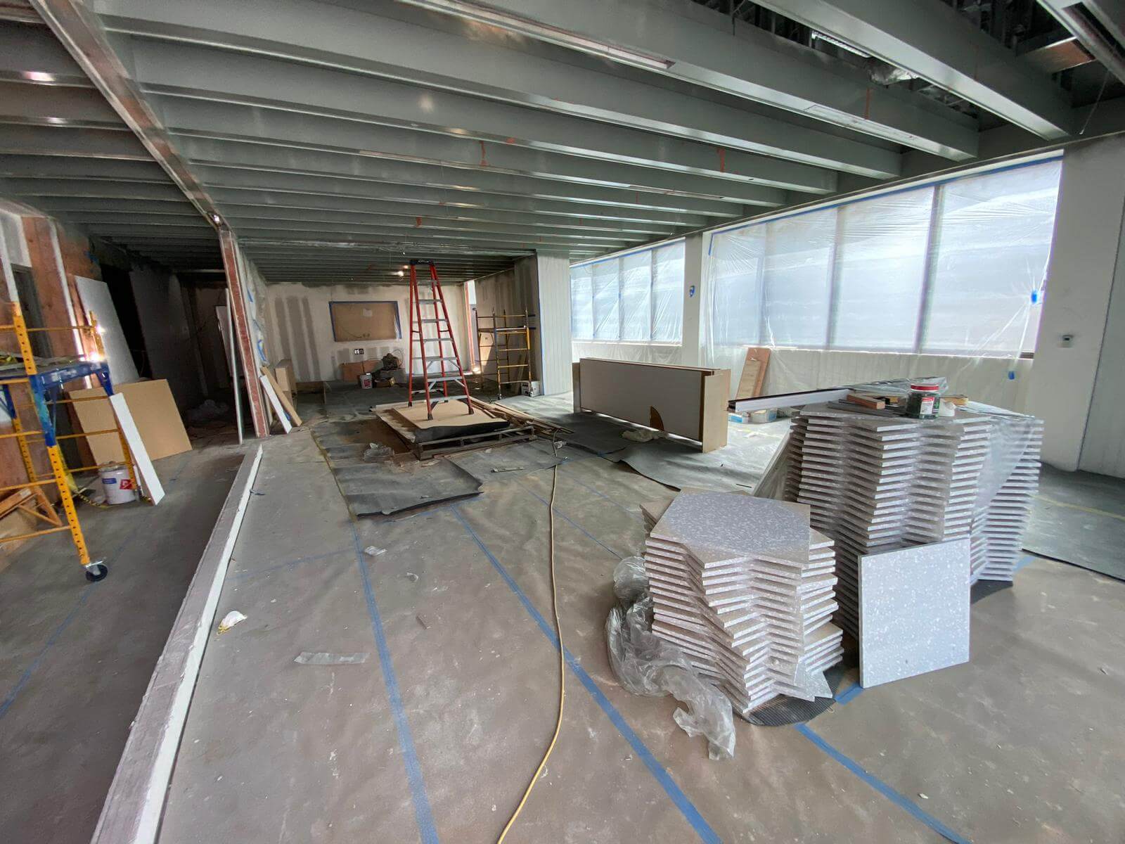 Commercial dining area with tile stacked for installation