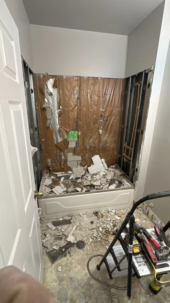 Demolition of the old tub surround down to block and studs